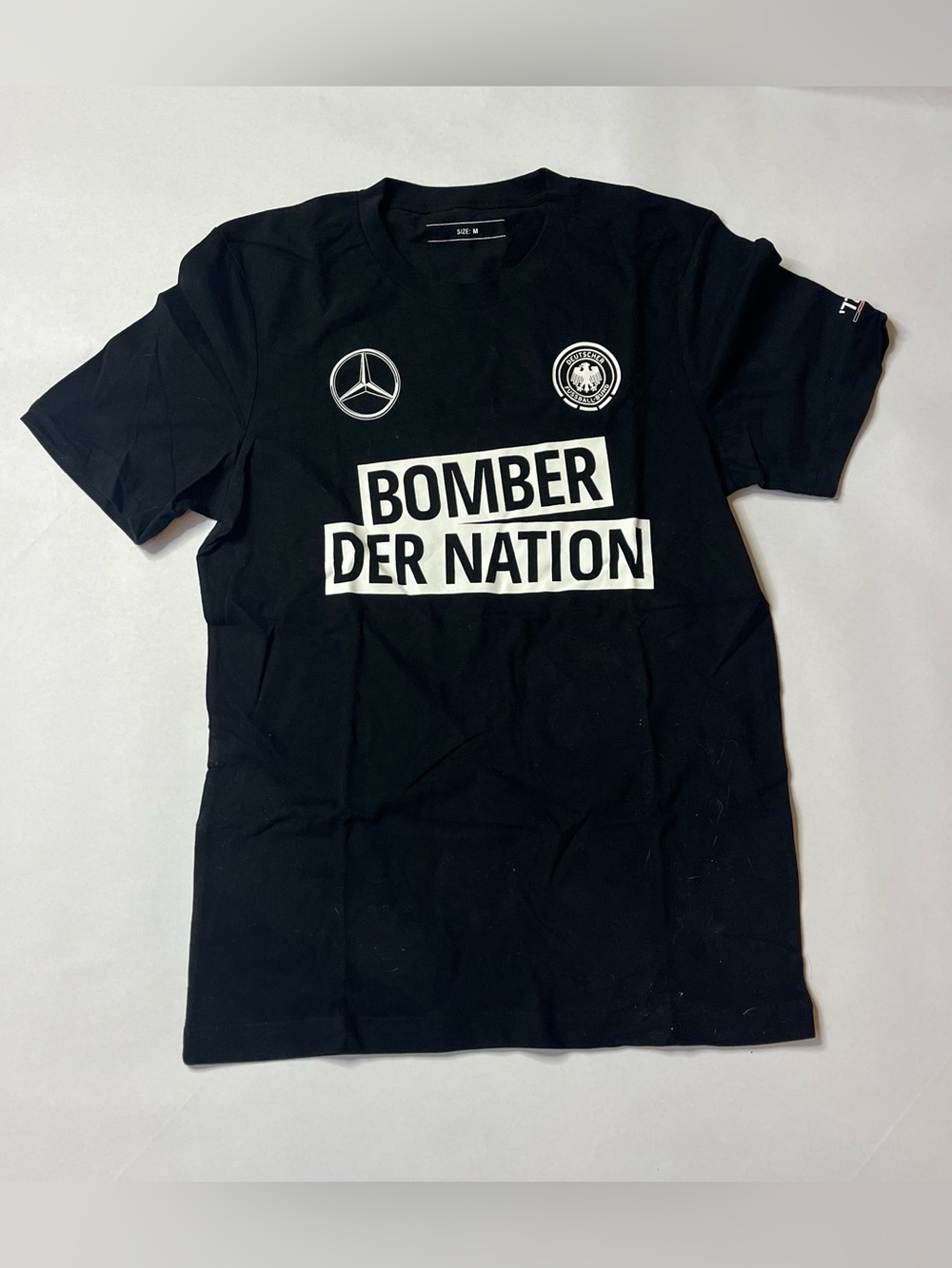 Bomber Der Nation Black Graphic Tee with Mercedes Logo Soccer Shirt